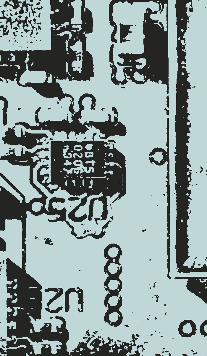 Macro photograph of a circuit board in a screenprint treatment - surface-mount components around IC U25.