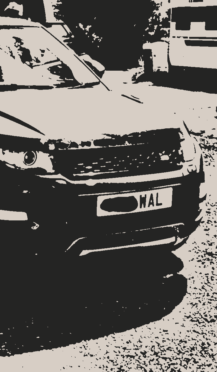 Screenprint of the Peak Film transport vehicle - front view showing the grille and registration plate.